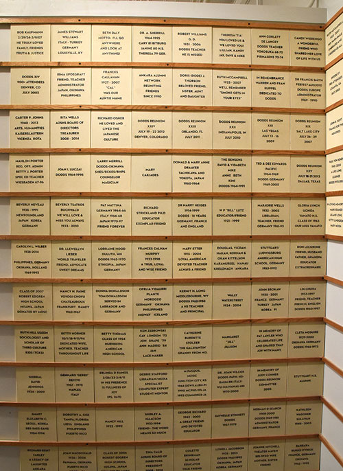 Medium, beige quarry memorial tiles hanging on wall