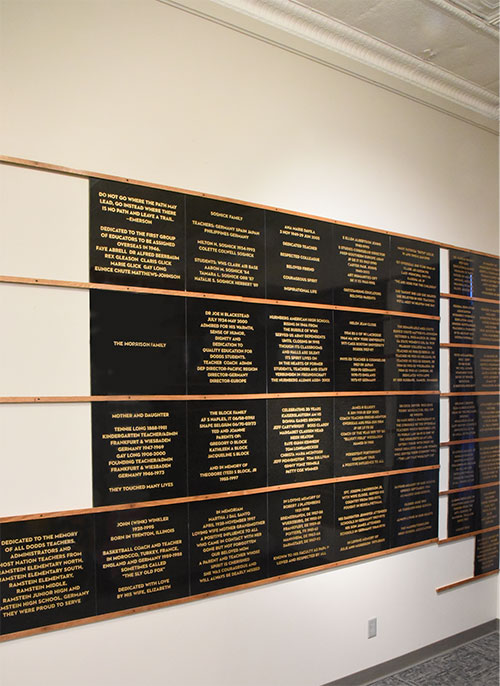 Large, polished granite memorial tiles hanging on wall